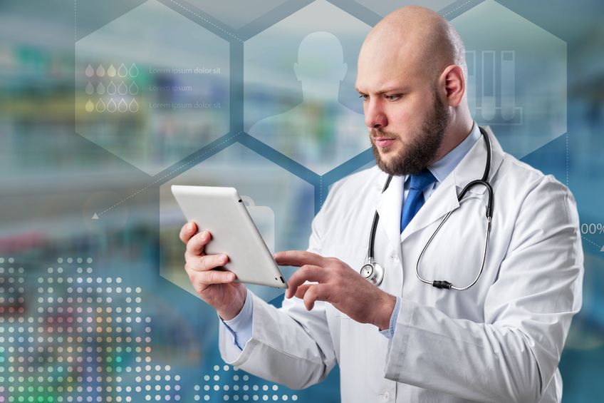 doctor looking at tablet