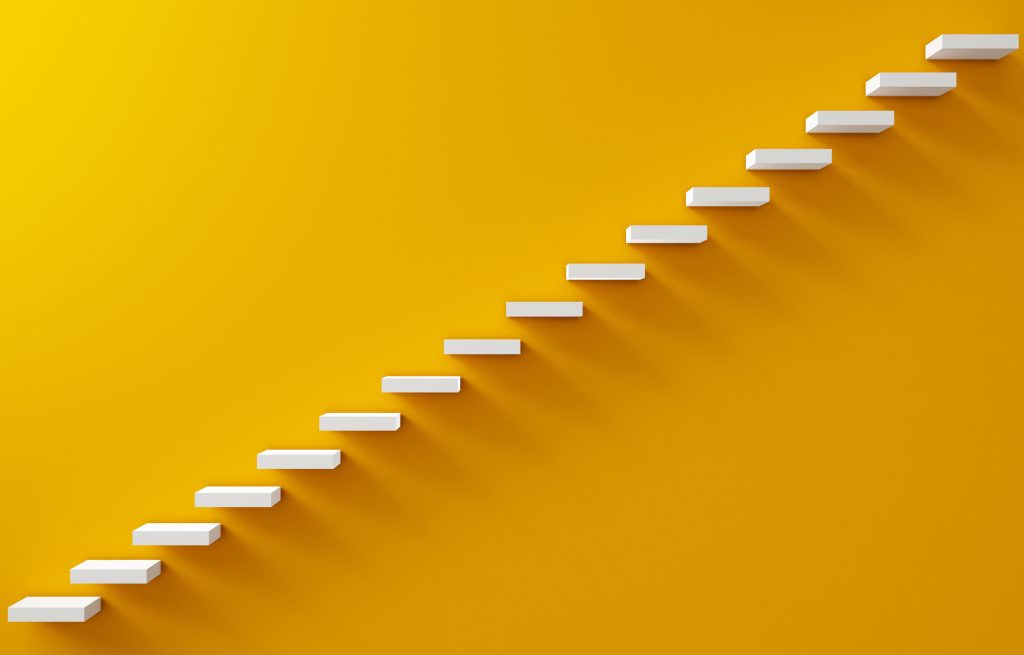 stairs along a yellow wall